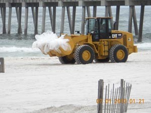 Cleaning up oil on Pensacola Beach