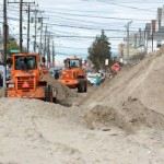 Removing sand after Hurricane Sandy