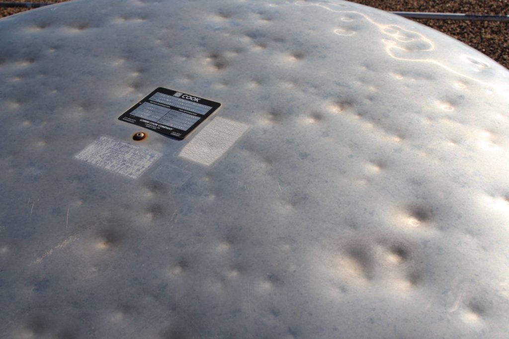 Roof vents damaged by hail at Amarillo High School. Photo by Complete.