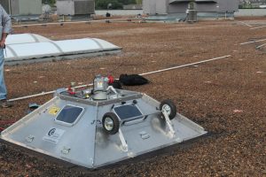 Uplift testing on built-up gravel ballasted roof. Photo by Complete.